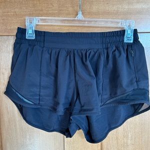 Black lululemon HOTTY HOT shorts with no liner.